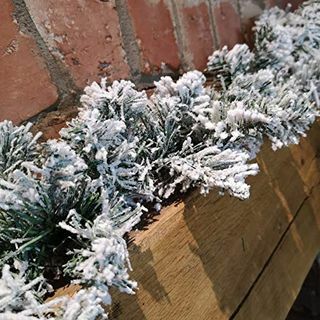 Guirnalda imperial de Navidad verde de lujo con muñeco de nieve