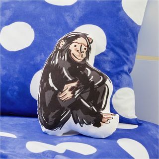 Almohada de chimpancé sentado